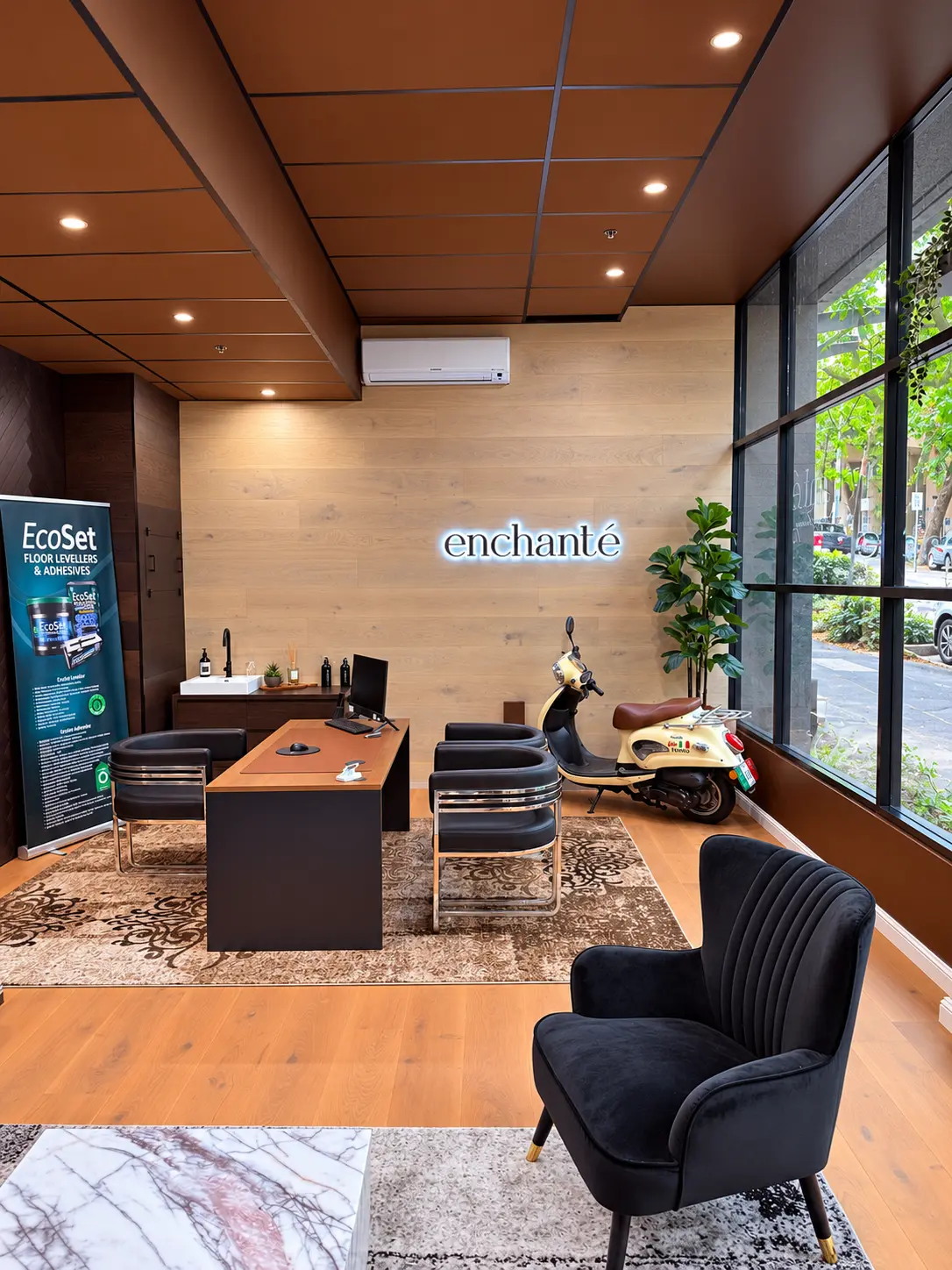 Consultation desk beneath the Enchanté sign